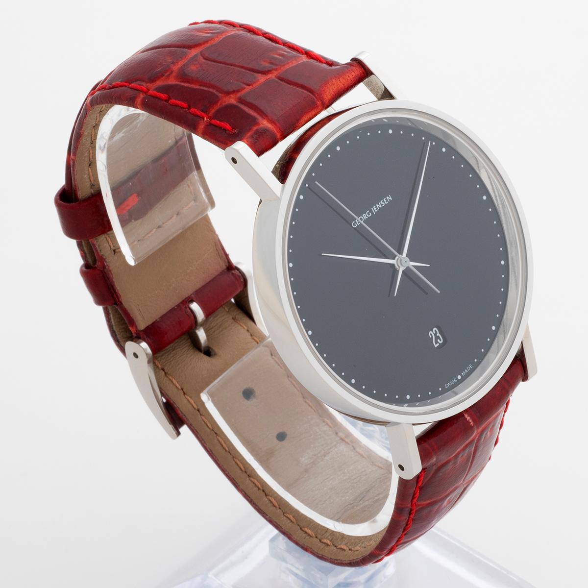 Our Georg Jensen designed by Henning Koppel reference 318 is the large size with 41mm stainless steel case black gloss dial , original leather strap and tang buckle, with quartz movement. Presented in outstanding condition with only light signs of