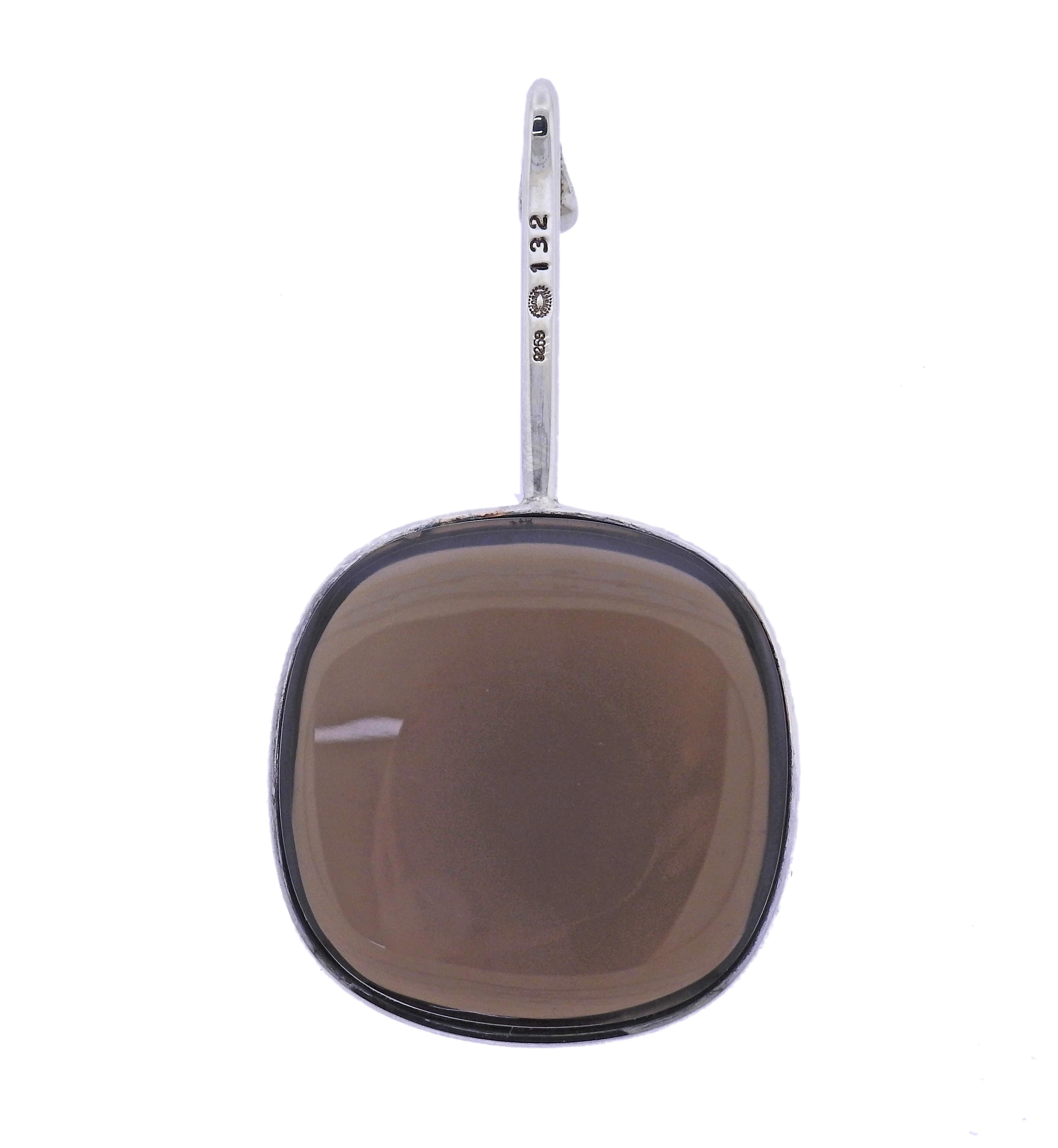 Brand new Georg Jensen sterling silver Dew Drop pendant with smokey quartz. Pendant is 65mm x 35mm *(Necklace on the model is for display purposes only*). Model # 3536446. Marked: GJ mark, 925 S, 132. Weight - 43.3 grams.