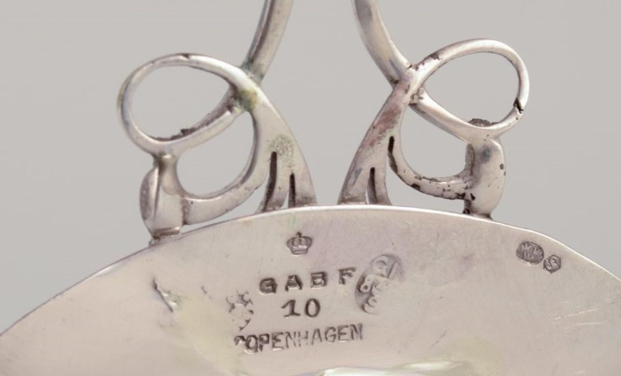 Silver Georg Jensen, early tea strainer with holder in 830 silver.