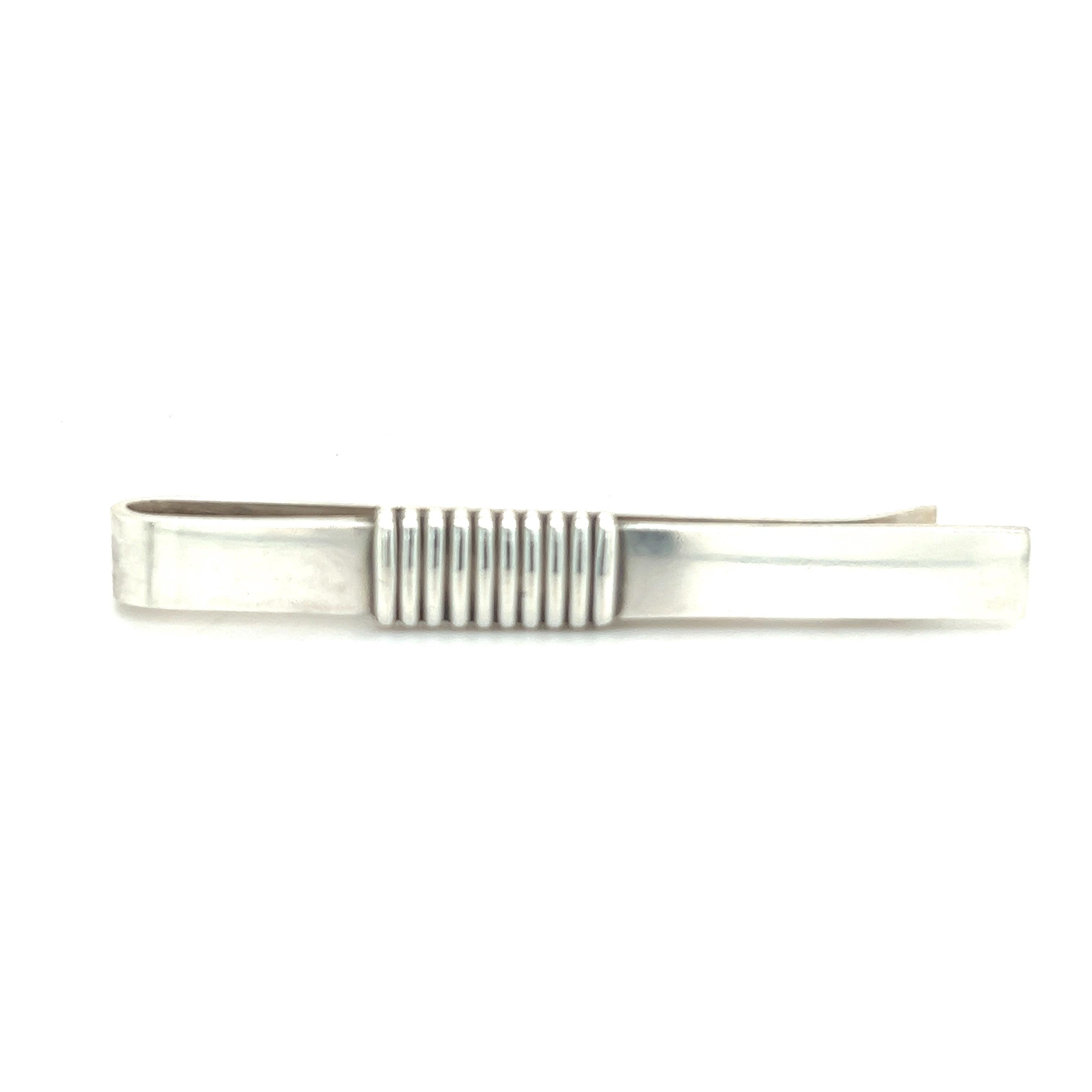 Authentic Georg Jensen Estate Money Clip Tie Bar Silver GJ13

This elegant Authentic Georg Jensen Men's Money Clip Tie Bar is made of sterling silver and has a weight of 8.95 grams.

TRUSTED SELLER SINCE 2002

PLEASE SEE OUR HUNDREDS OF POSITIVE