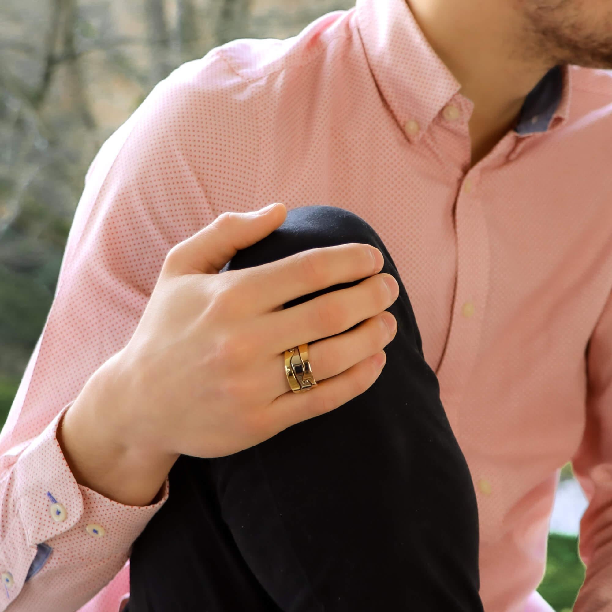 A rather interesting Georg Jensen tri-coloured 'Fusion' puzzle ring set in solid 18k gold. 

This unique piece is composed of three different coloured gold bands each of which having their own unique grooved pattern. These patterns cleverly slot