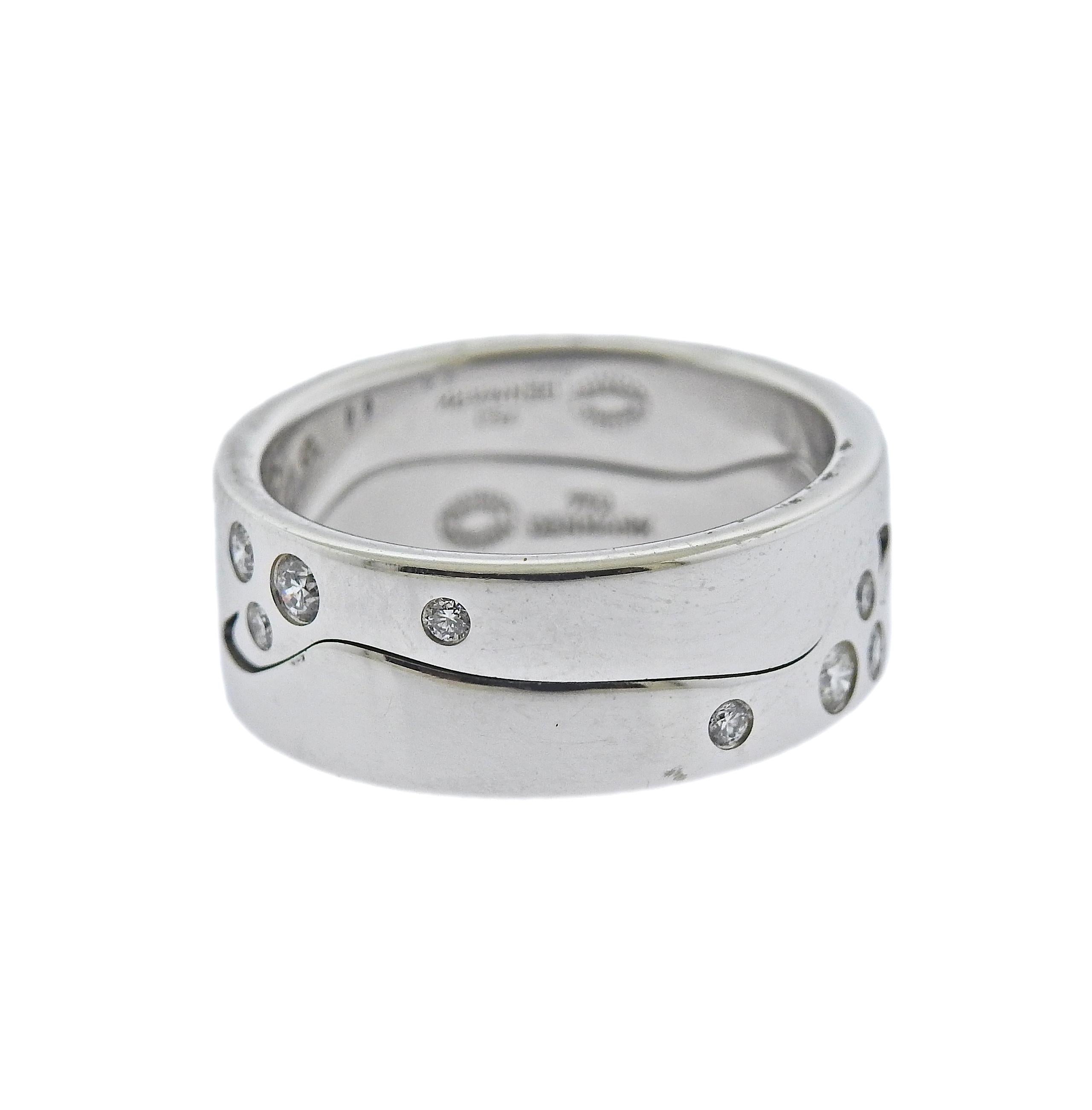 Brand new, set of 2 Georg Jensen stackable puzzle rings from current Fusion collection, set with 0.32ctw of VS/G white diamonds. Rings are 8mm wide when worn as a set of 2. Available in following sizes: 52; 53; 54; 54; 55; 56; 57; 58. Weight is 10.5