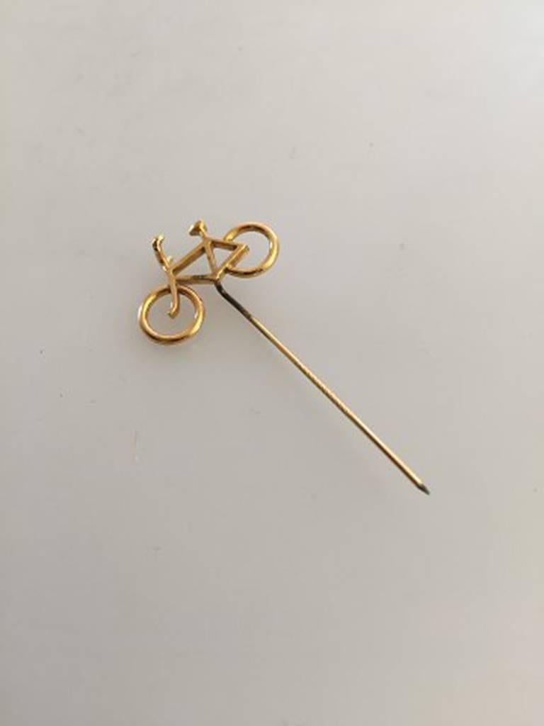 Georg Jensen Gilded Brass Bicycle Pin Needle. Designed by Ole Bent Petersen

Measures 5.8 cm / 2 9/32 in. x 2.7 cm / 1 1/16 in.
Weighs 1.8 g / 0.06 oz.