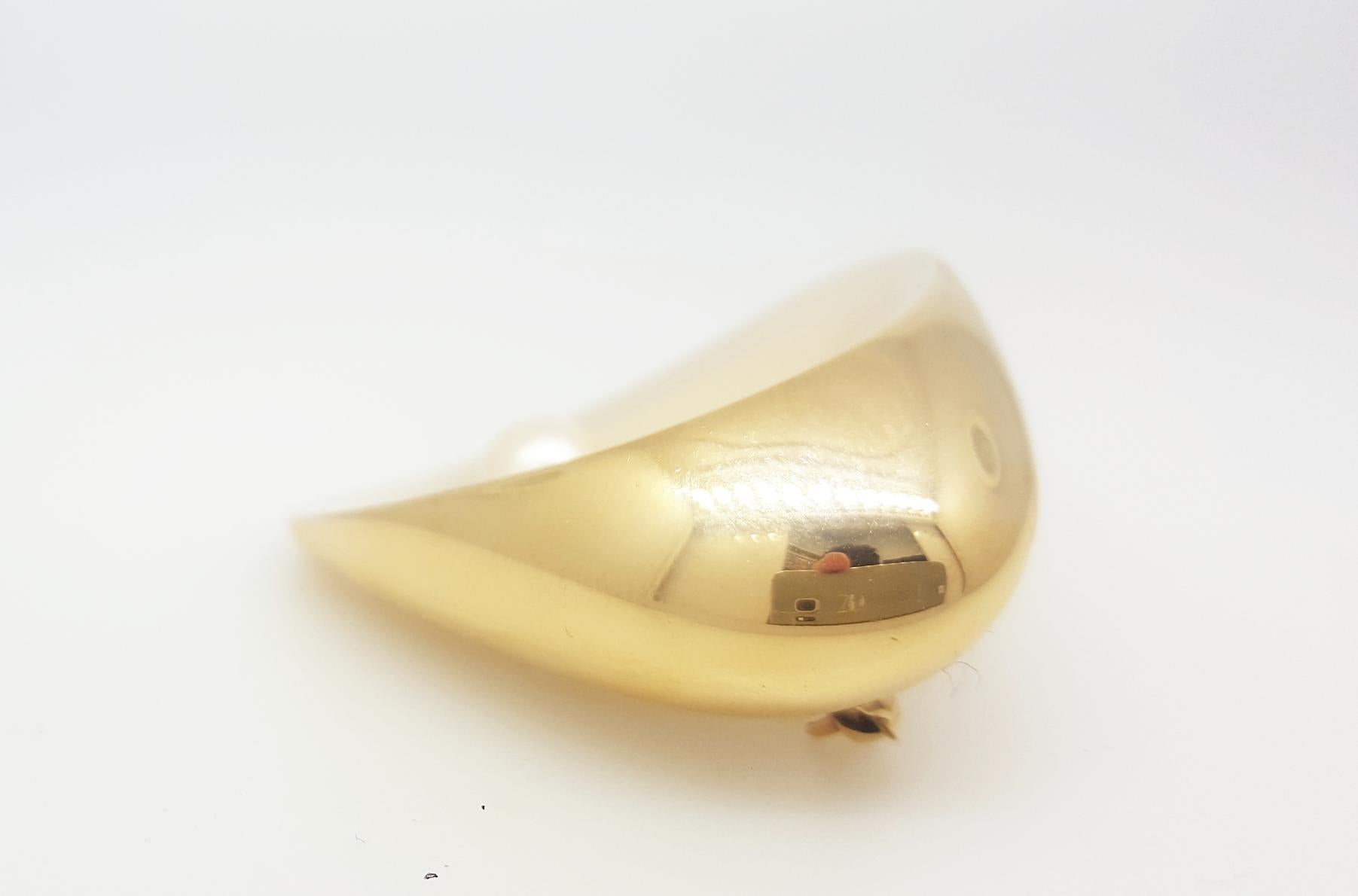 A Georg Jensen 18 karat yellow gold brooch designed by Nanna Ditzel for Georg Jensen. Circa 1956. Cultured Pearl approximately 7.0mm. The brooch measures 2.25 x 1.7 inches. Excellent Condition.