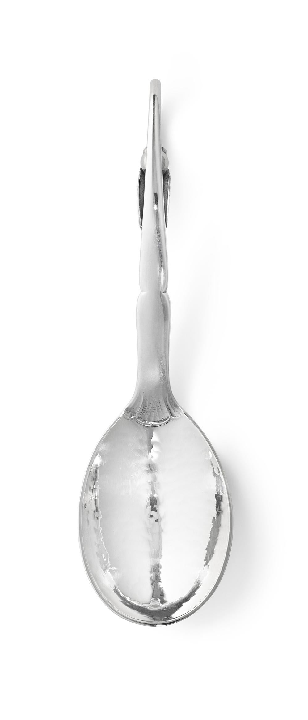 Ornamental items from the Georg Jensen Silversmithy are individual flatware pieces, all of which were designed by Georg Jensen in the period 1912–1923. Even today every piece is made in the old artisan tradition of craftsmanship. Ornamental items