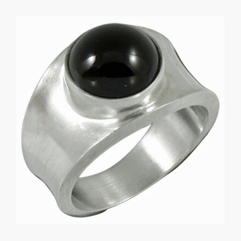 Georg Jensen Hematite Ring Sterling Silver, post 1945. The ring bezel set with cabochon hematite. Size 8.5. Full Georg Jensen marks and 925 S Denmark design number 124. Total Item Weight: 8.26 grams.