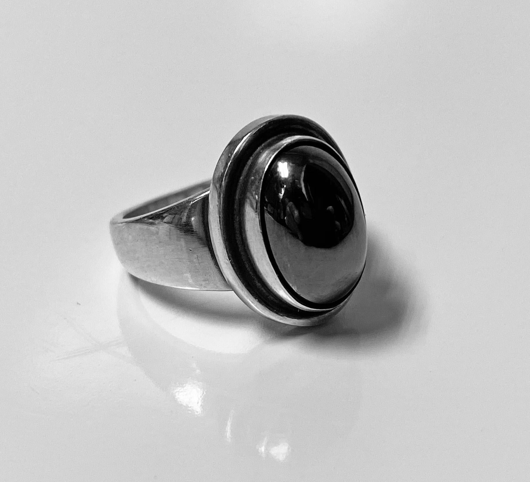 Georg Jensen Ladies Ring, designed by Harald Nielsen.The Ring bezel set with oval hematite.Full Georg Jensen marks to underside, post 1945, Denmark 46 B. Item Weight: 7.54 gm. Ring Size: 6.50.