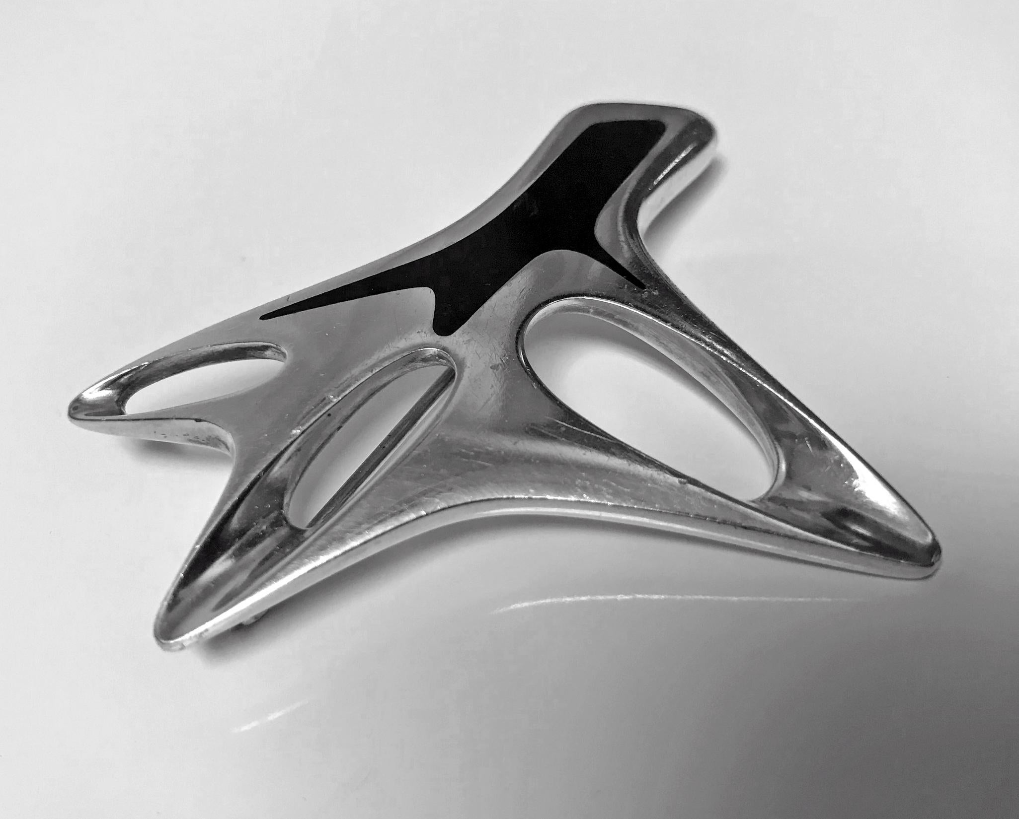 Georg Jensen Sterling Silver Abstract Brooch with Black Enamel No 323 - Henning Koppel. Designed by Henning Koppel 1918 - 1981. Stamped with post-1945 GJ Hallmarks and HK initials. Measures: 2.50 x 2.25 inches. Weight: 34.85 grams. Extreme minor