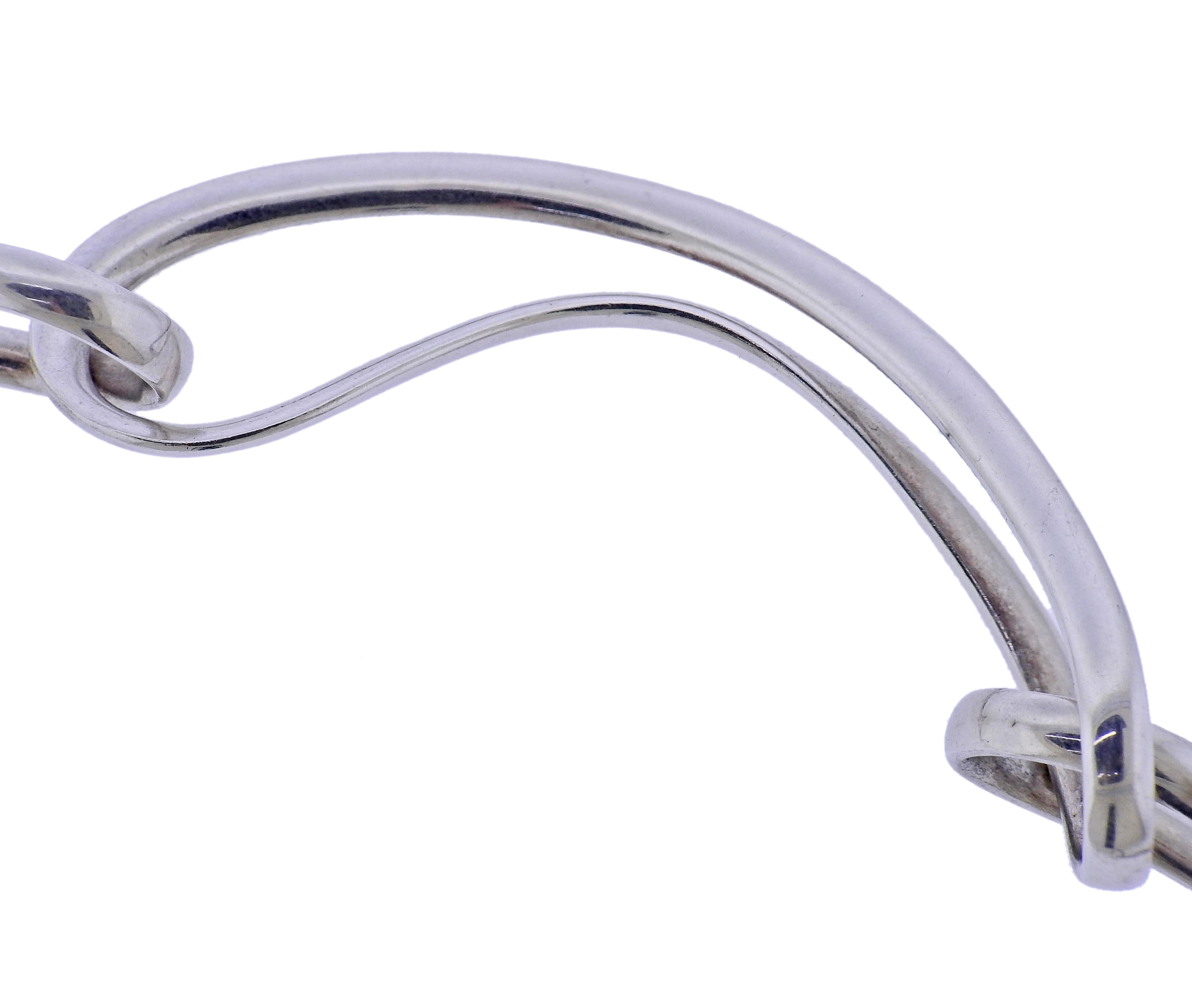 Brand new Georg Jensen sterling silver Infinity link necklace. Necklace is approx. 16mm wide. Available in size S, measures approx. 16