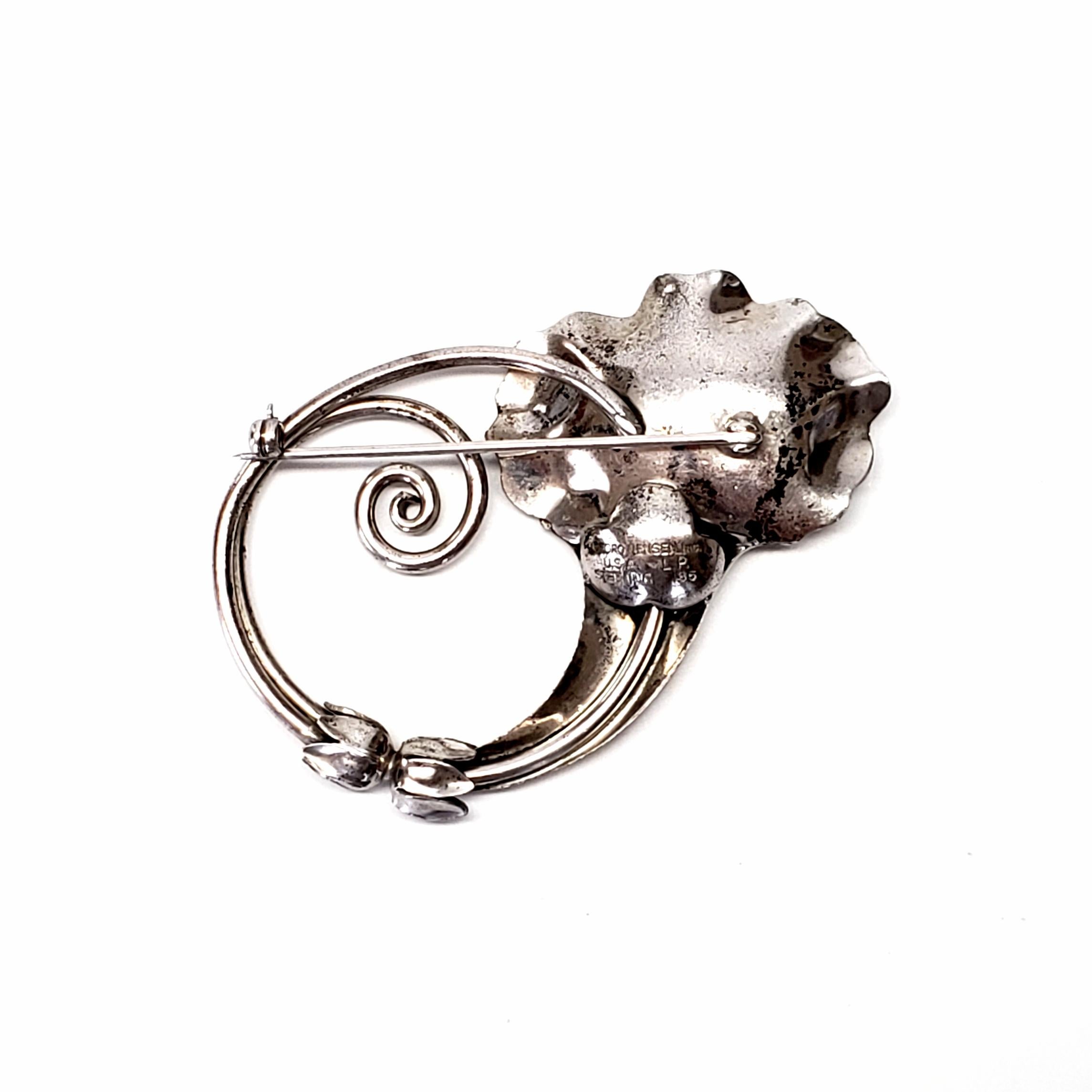 Vintage Georg Jensen USA sterling silver trumpet flower pin / brooch, designed by Alphonse LaPaglia, circa 1940s.

Georg Jensen USA of 5th Avenue in NYC sold decorative items including jewelry, after sole agency rights were granted for 100 years in