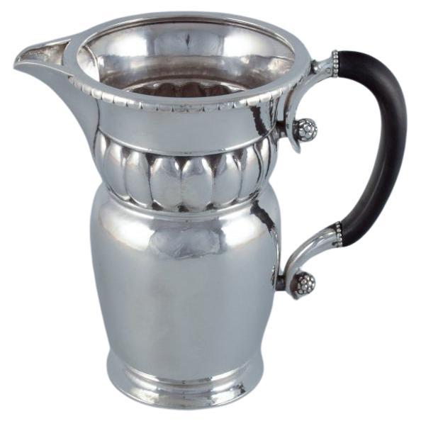 Georg Jensen, large Art Nouveau pitcher in sterling silver. Early and rare model For Sale