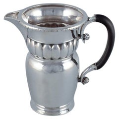 Antique Georg Jensen, large Art Nouveau pitcher in sterling silver. Early and rare model