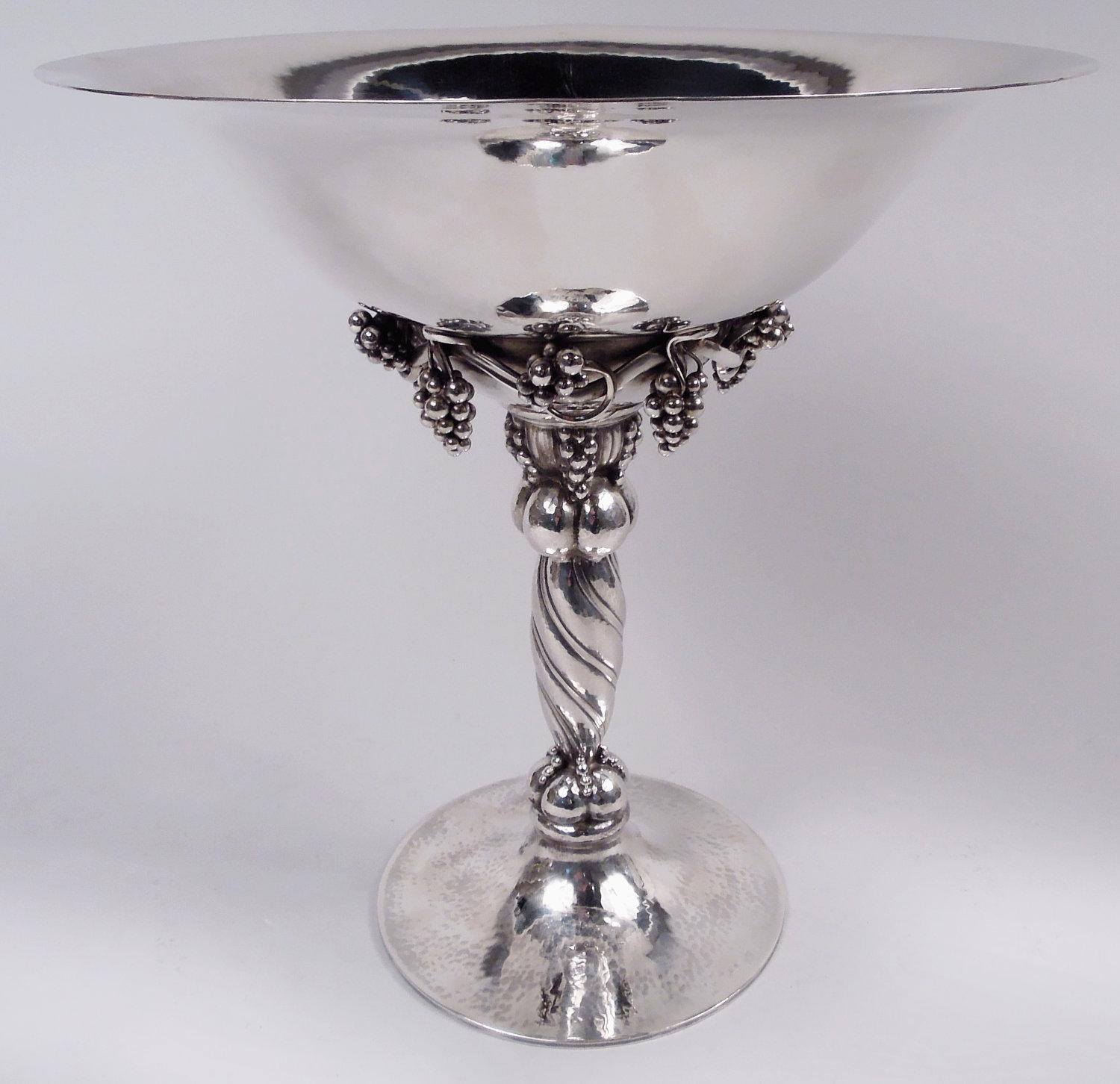 Danish Modern sterling silver tazza compote. Made by Georg Jensen in Copenhagen. Wide and tapering bowl; applied fruiting grapevine with cast pendant bunches encircling underside. Twisted shaft between lobed knops with applied bunches and beading.