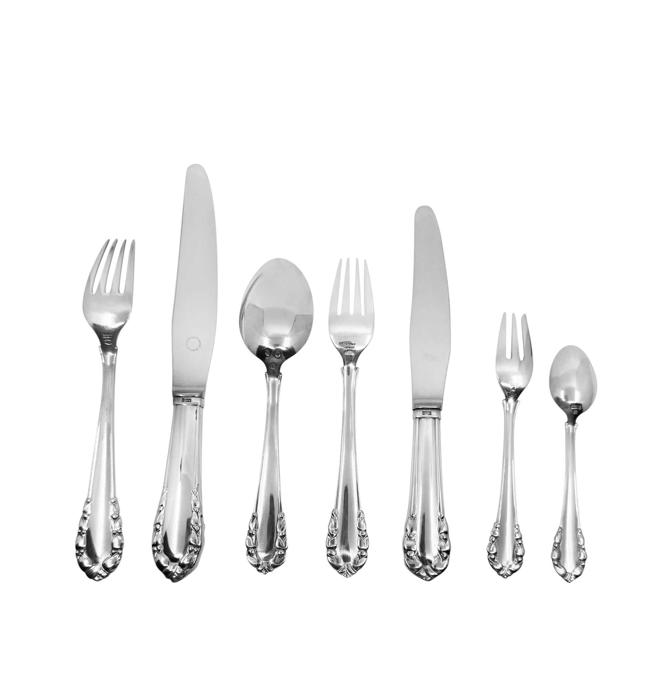 A complete Georg Jensen Lily of the Valley sterling silverware set, designed by Georg Jensen in 1913. This elegant and timeless pattern reflects Jensen’s early Art Nouveau style, characterized by soft organic lines and delicate floral motifs. The
