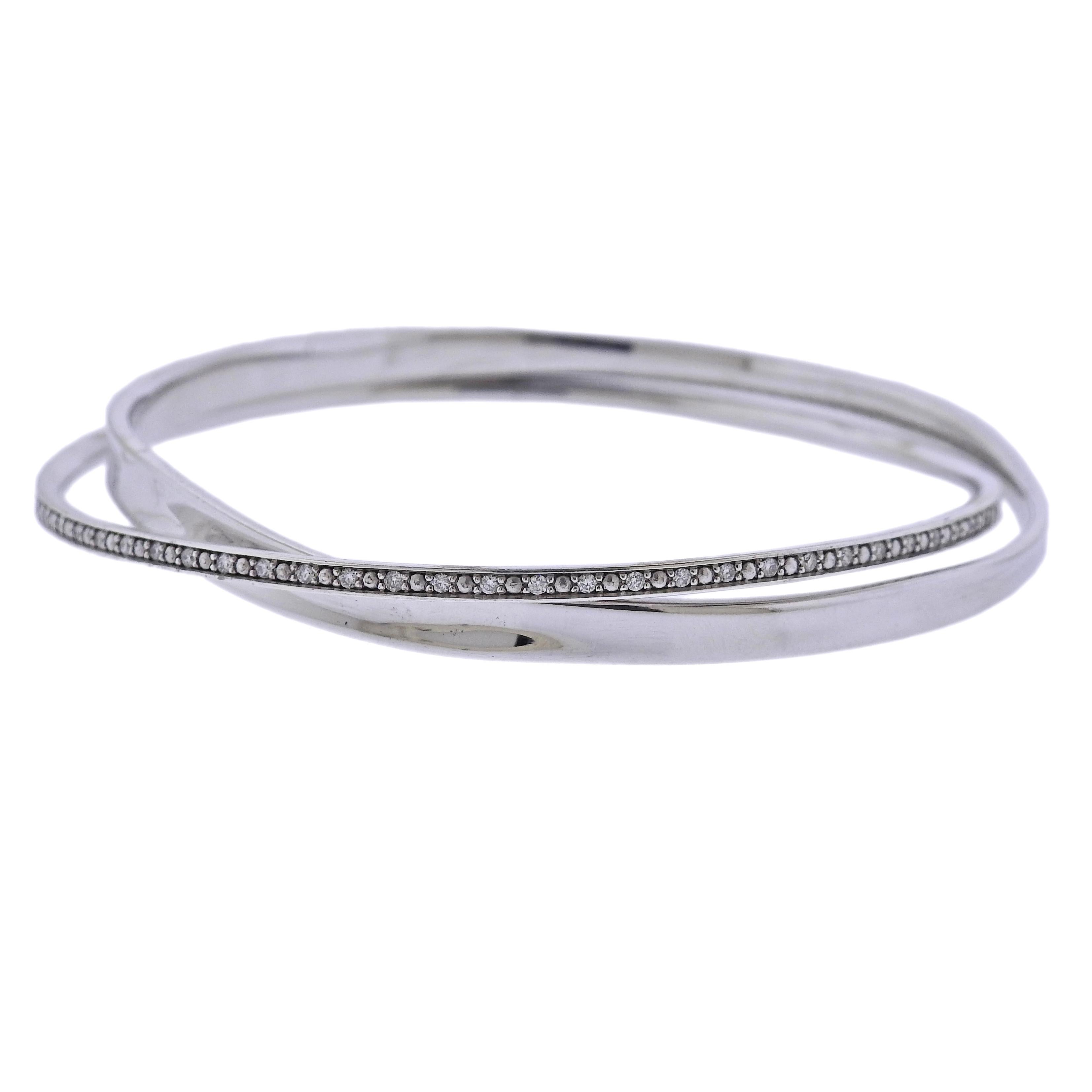 Brand new Georg Jensen sterling silver Marcia bangle bracelet with approximately 1.20ctw G/VS diamonds. Bracelet marked M for size Medium and will fit approx. 7