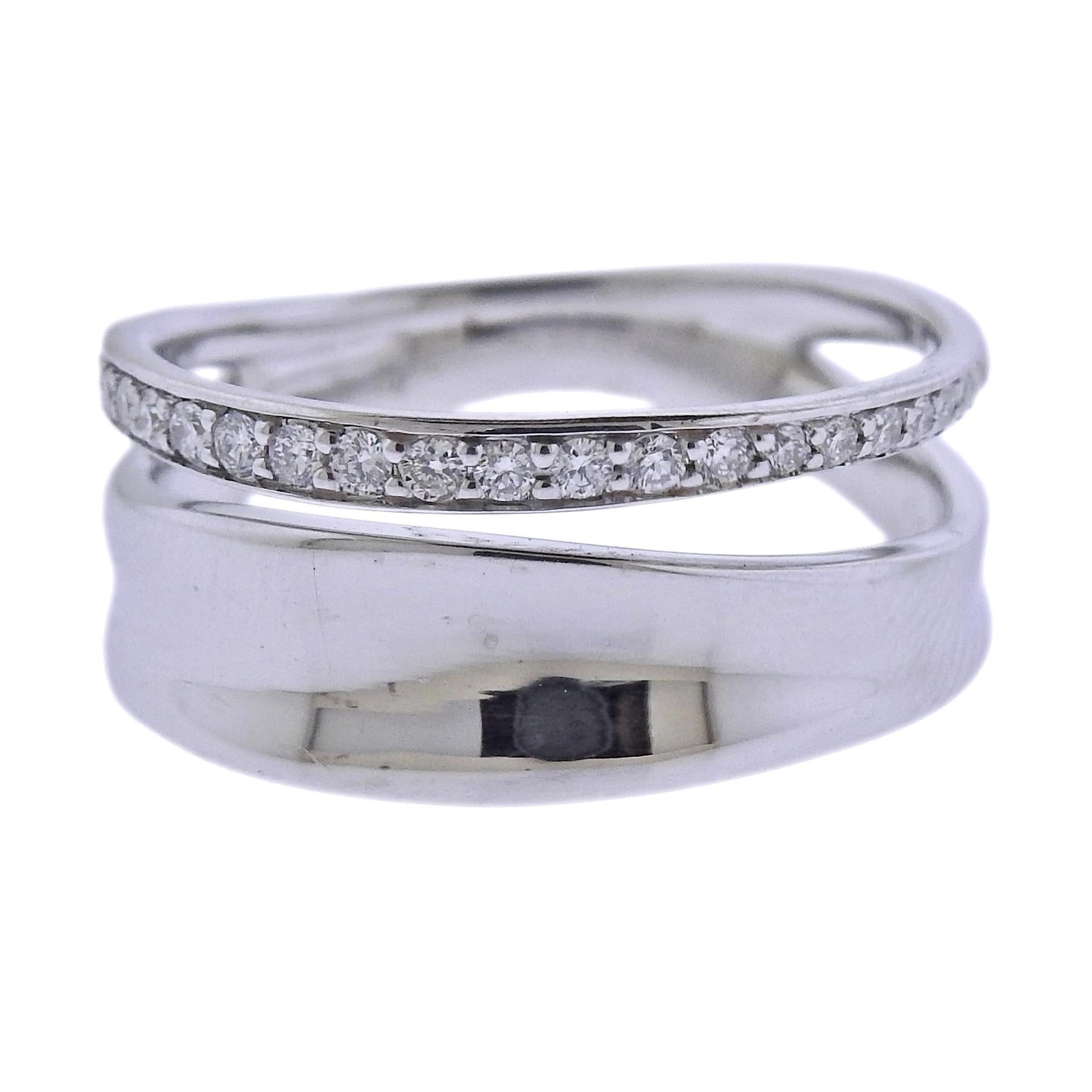 Brand new Georg Jensen sterling silver Marcia ring set with approximately 0.17ctw G/VS diamonds. Top of the ring measures 9mm wide, following sizes are available: 53;57;58. Model# 3560940. Marked: GJ, 925 S, 618 B. Weight is 3.7 grams.