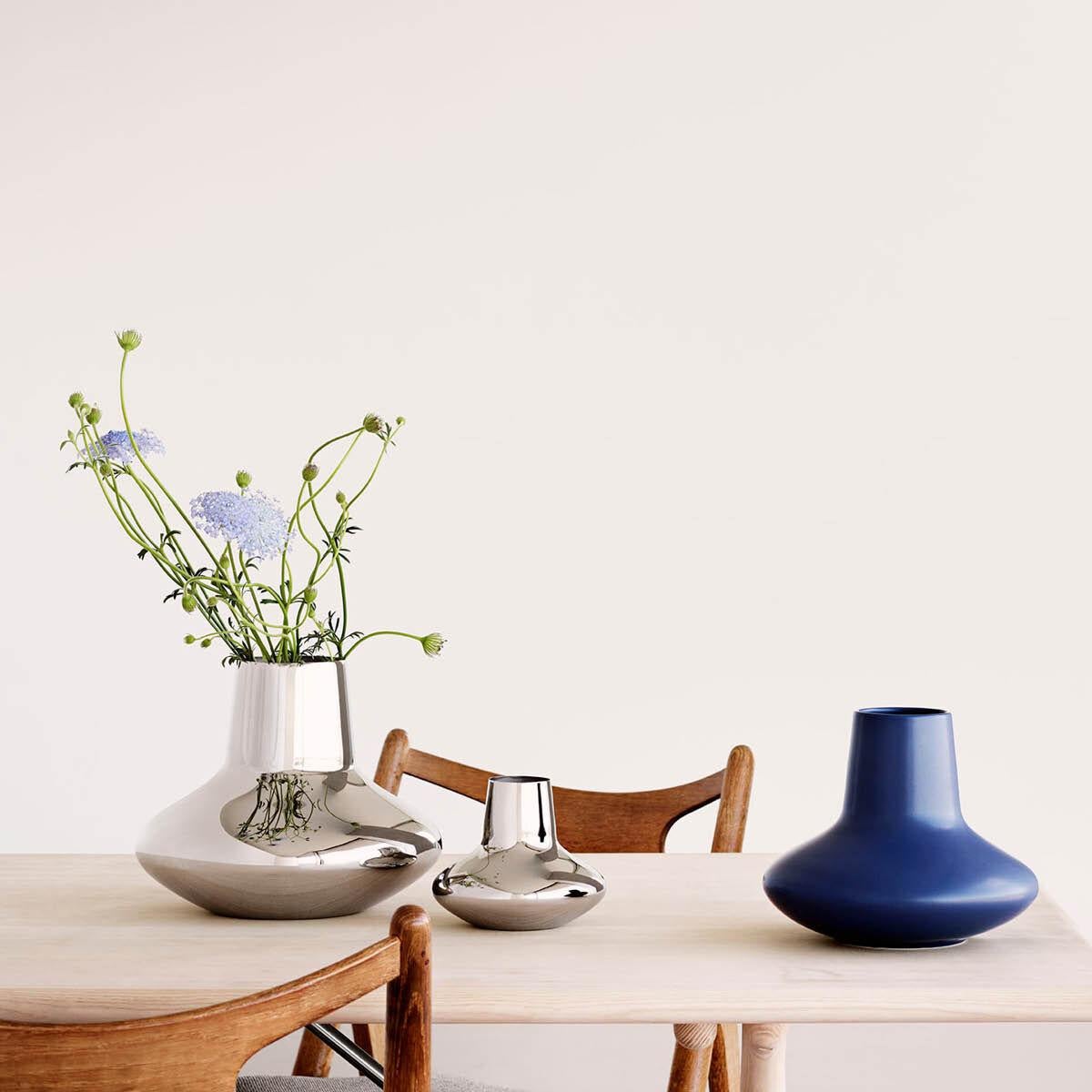 With its elegant proportions and mirror-polished surface, this medium-sized stainless steel vase is a beautiful example of minimalist Scandinavian design. Understated enough to allow the flowers within to really take centre stage, the vase