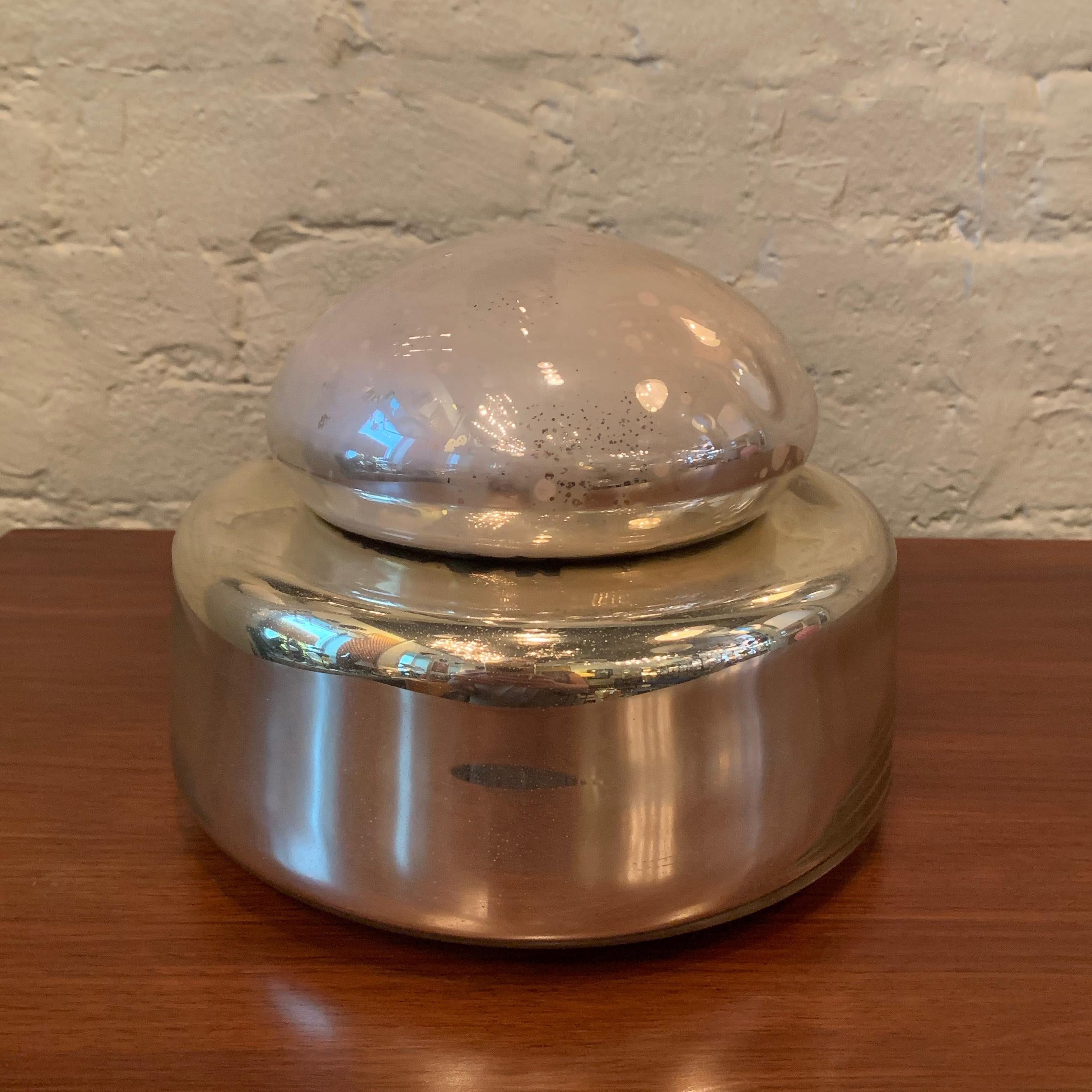 Mid-Century Modern, two-toned, mercury glass, serving bowl or vessel by Georg Jensen features a gold base with patinated silver lid.