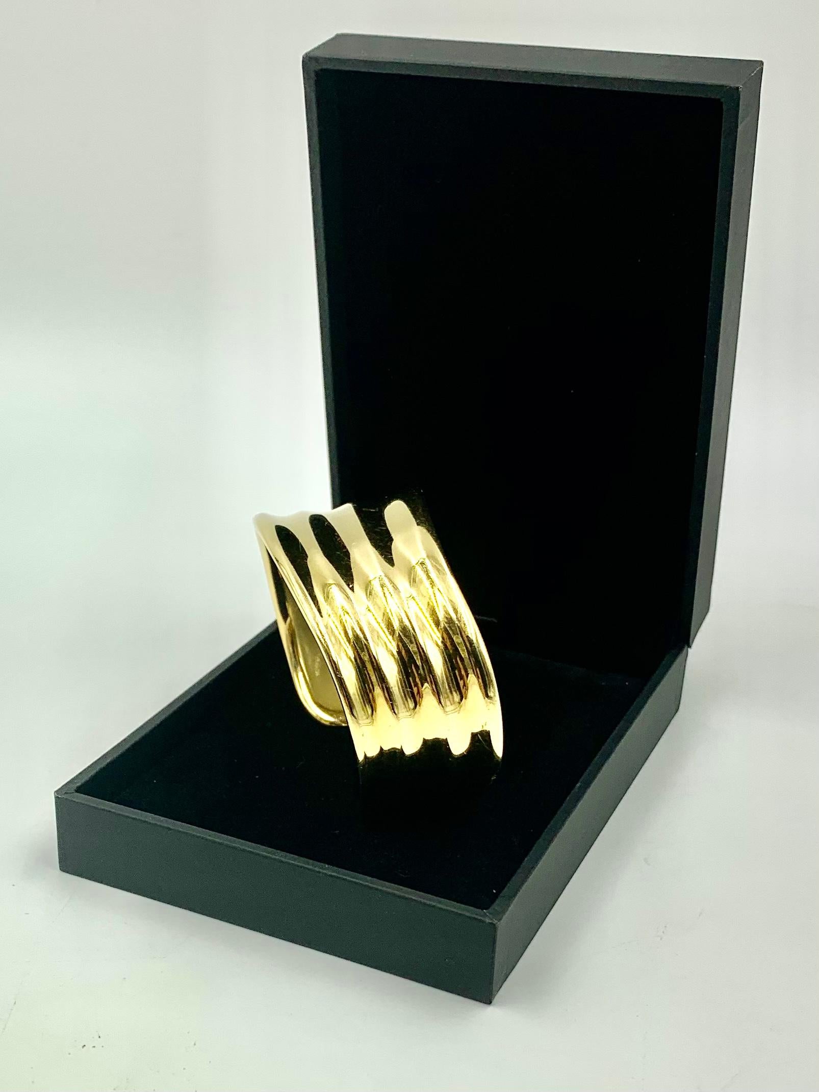 Substantial Georg Jensen Minas Spiridis 18K gold organic form cuff bracelet. The design reminiscent of the gentle waves of the Greek Isles. Wonderfully comfortable, easy fit, a pleasure to wear.
Minas Spiridis was the first non-Scandinavian designer