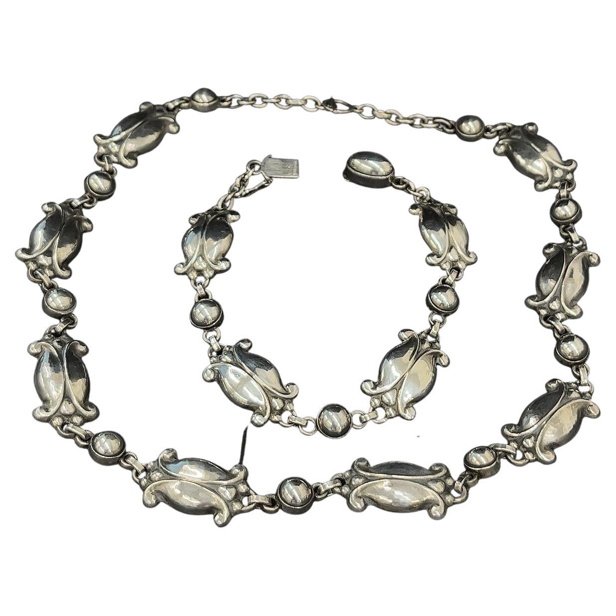 Beautifully designed, this set is a classic Georg Jensen Necklace Sterling No 15 Moonlight Blossom Vintage 1970s necklace with matching no 11 bracelet  
Total Weight: 33.3g necklace, 19.3g bracelet
Length: 16
