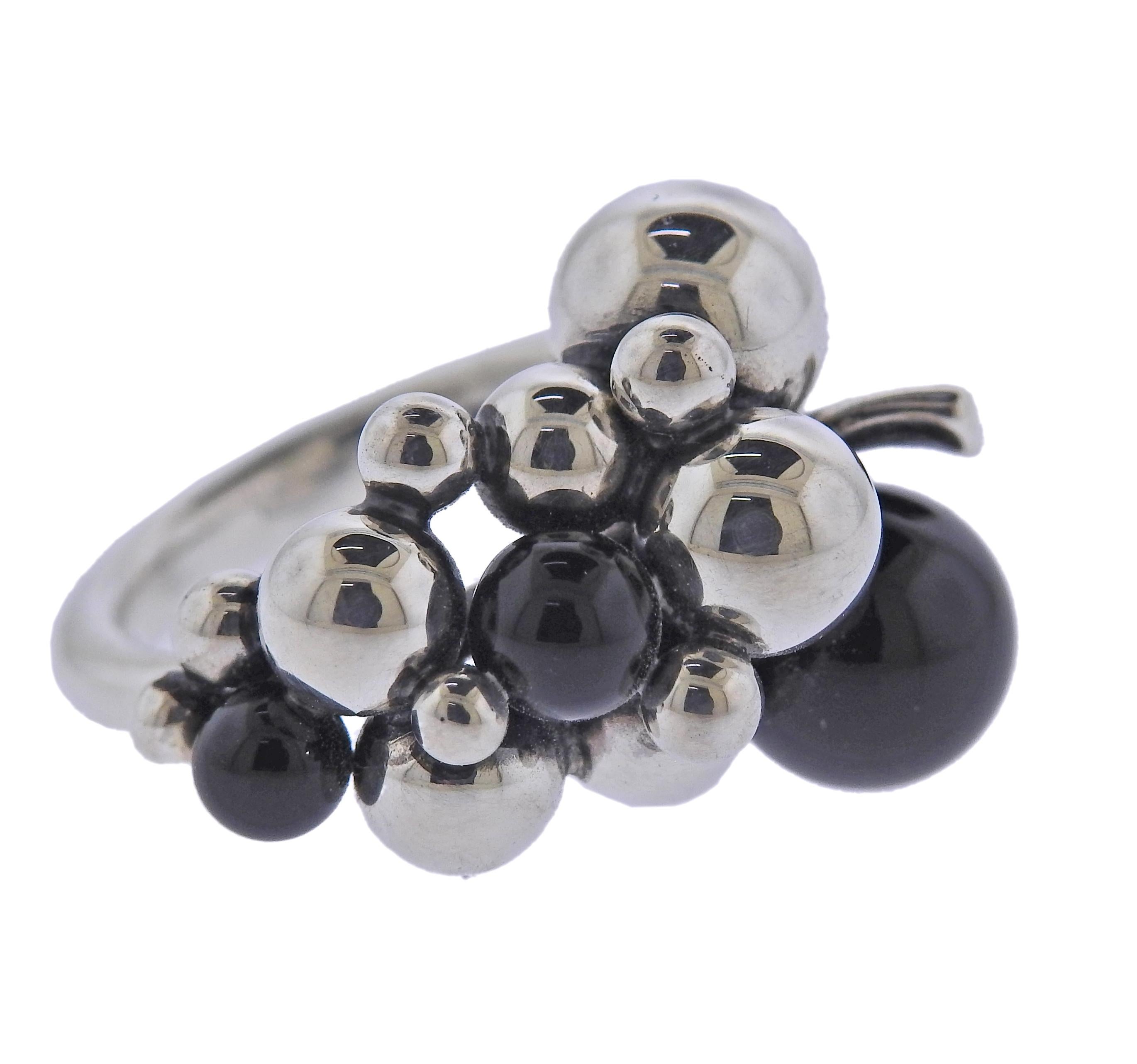 Brand new Georg Jensen sterling silver ring from Moonlight Grapes collection with onyx. Top of the ring - 24mm x 18mm. Available in sizes: 53 , 55, 54, 52 and 51. Model # 3559060. Marked: GJ mark, 925 S. Weight - 8.2 grams.