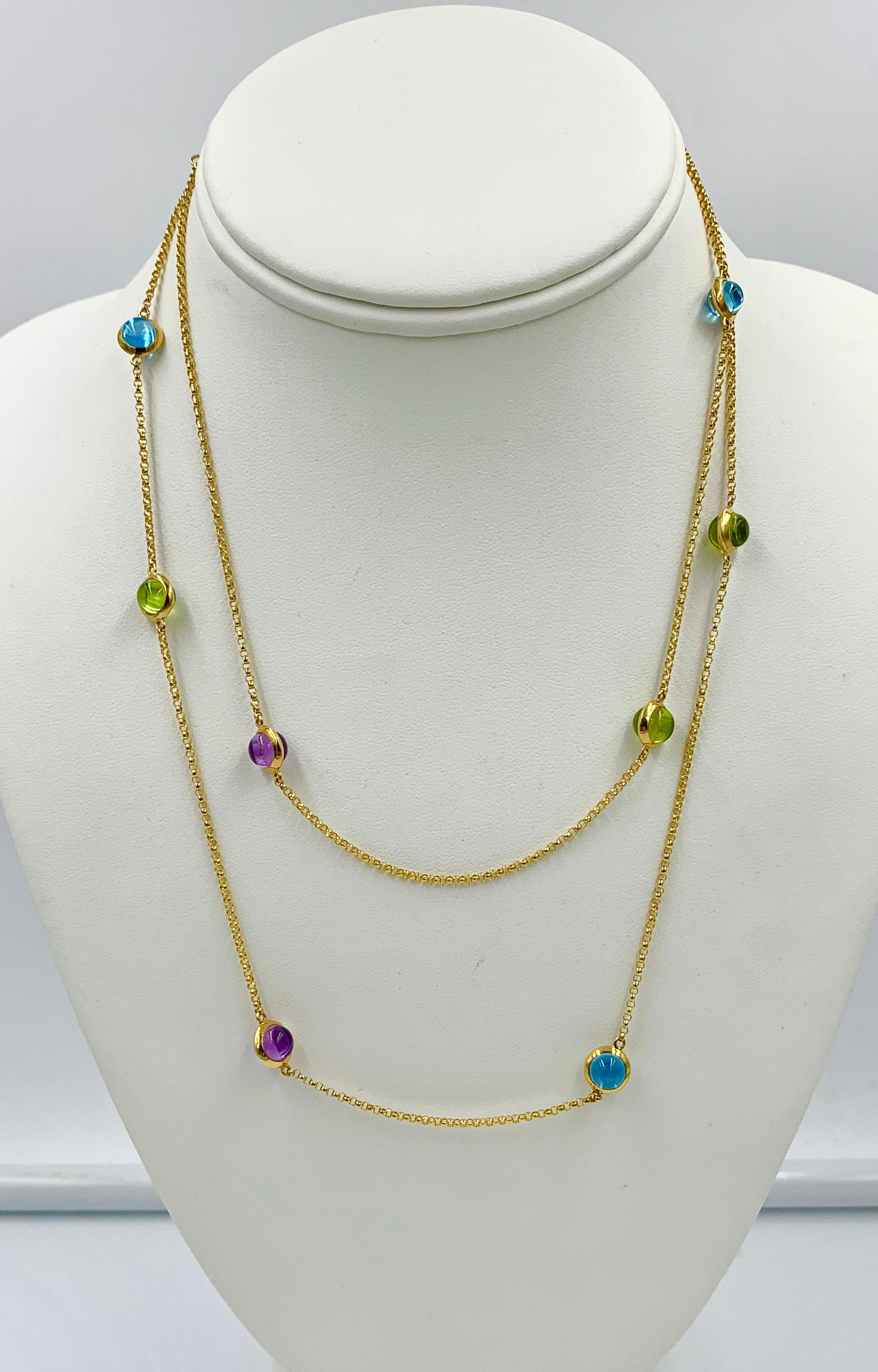 We are so delighted to have the iconic GEORG JENSEN Moonrise Sautoir Necklace in 18 Karat Yellow Gold with Topaz, Peridot and Amethyst gems in a diamonds by the yard design.  The very rare original Georg Jensen necklace was designed by David Chu for