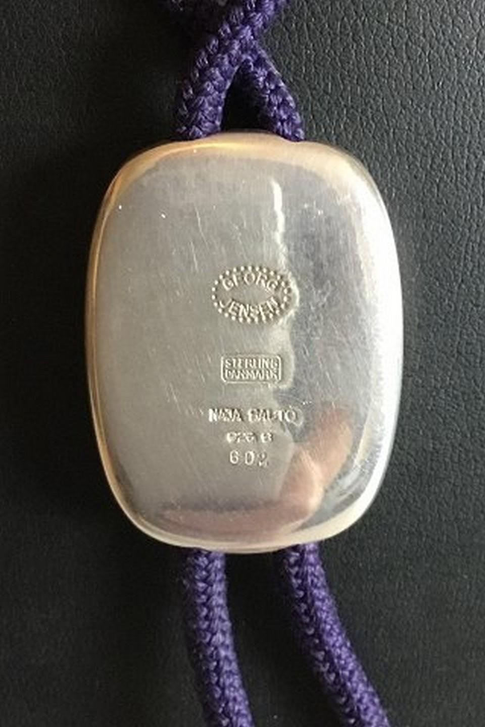 Georg Jensen Naja Salto Sterling Silver Enamel Neck jewelry No 602. Silver part measures 3.3 cm / 1 19/64 in. x 2.5 cm / 0 63/64 in. String measures 43 cm / 16 59/64 in. long, when the strings are double. Weighs 22 g / 0.80 oz.