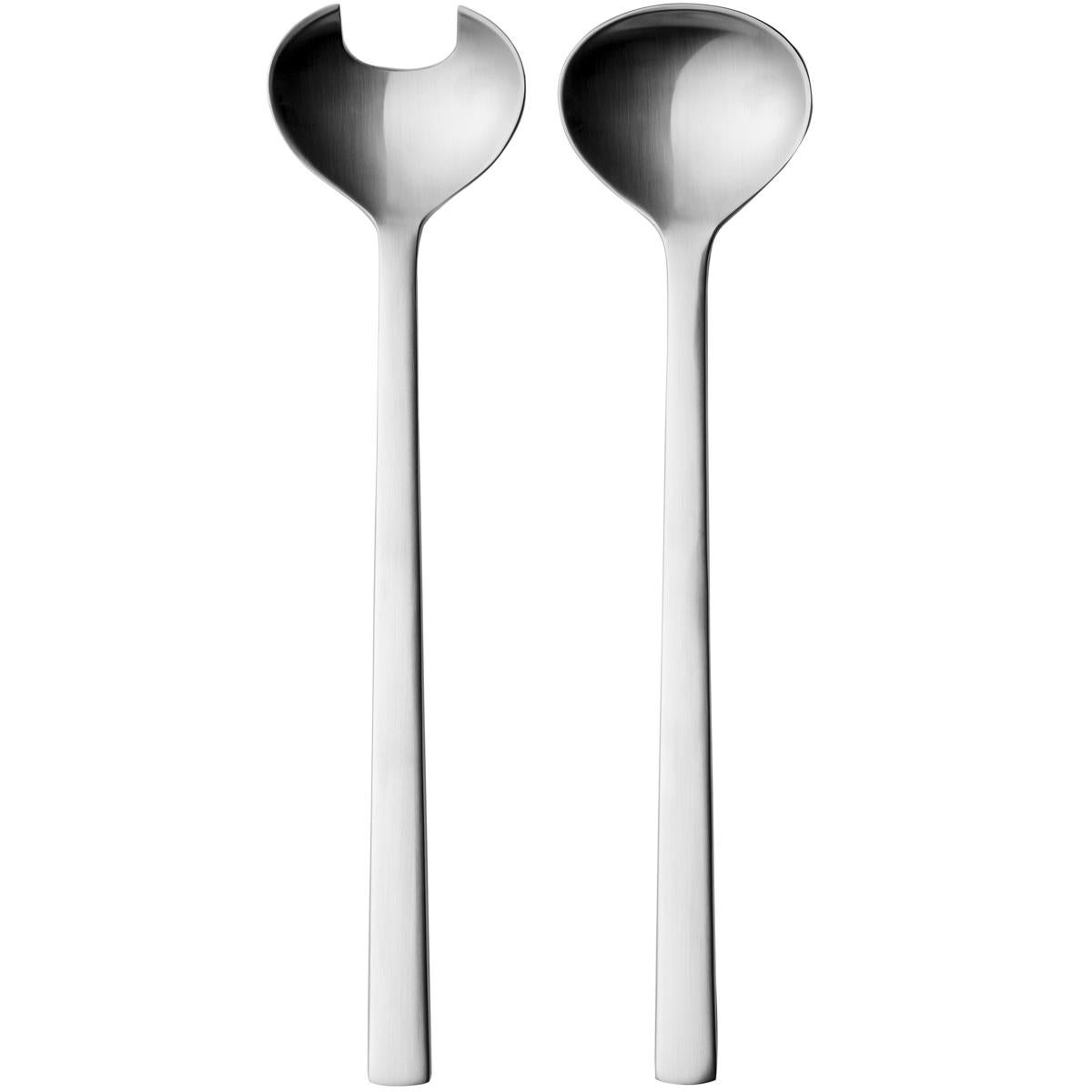 Stainless steel salad server giftbox. Henning Koppel designed the New York cutlery patternin 1963 as a tribute for a world exhibition in New York City. It instantly made history as a new departure in design for its clear-cut lines where the form