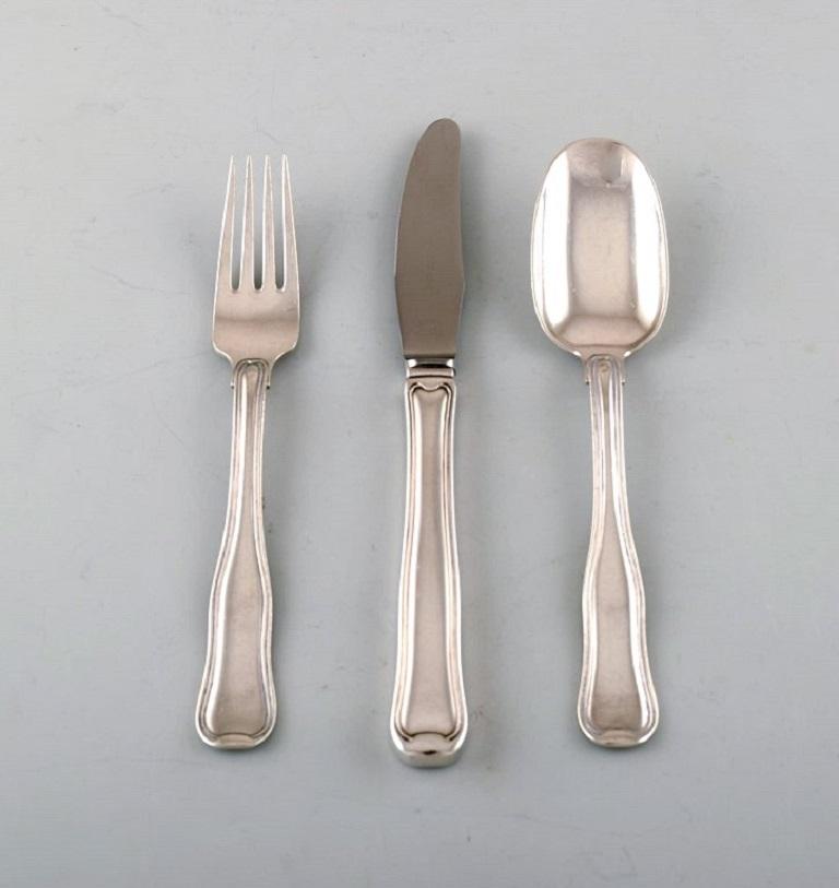 Georg Jensen Old Danish lunch cutlery in sterling silver. 
Lunch service for twelve people consisting of twelve lunch knives, twelve lunch forks and twelve lunch spoons.
In very good condition.
The knife measures: 19.5 cm.
Stamped.
Large