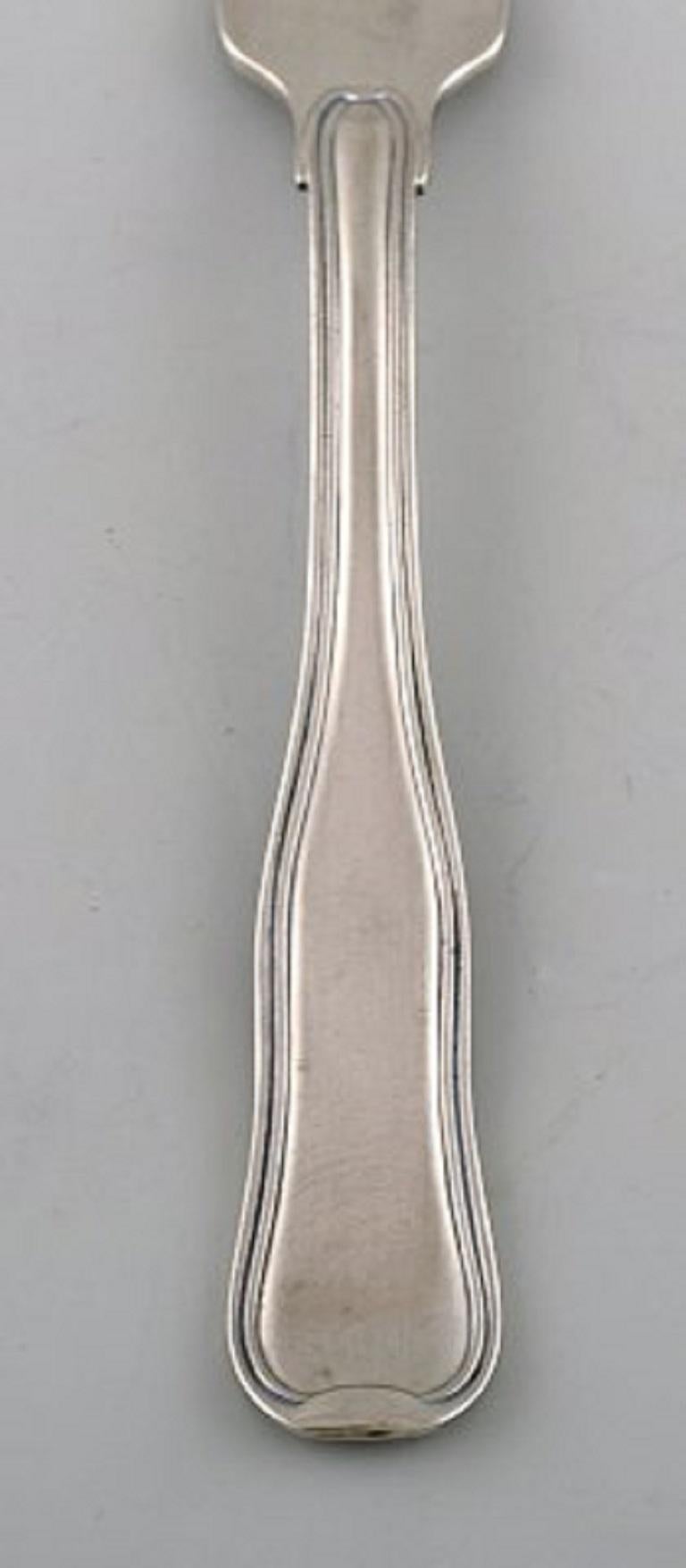 Georg Jensen Old Danish lunch fork in sterling silver and stainless steel. Three pieces in stock.
In very good condition.
Measures: 16.8 cm.
Stamped.
Large selection of Georg Jensen Old Danish in stock.