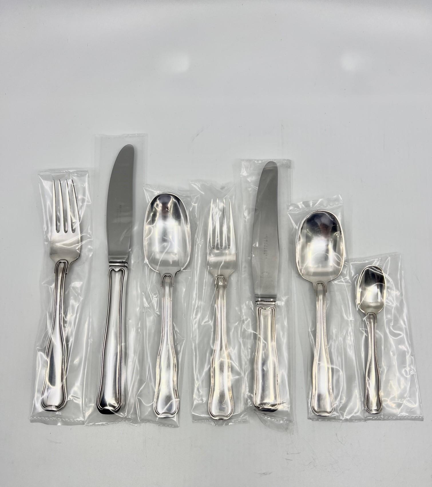 A complete vintage Georg Jensen Old Danish sterling silverware service for 12 persons. The Old Danish design was designed by Harald Nielsen in 1947, called “Dobbeltriflet” in Danish, Dobbeltriflet is often said to be Denmark’s national silverware