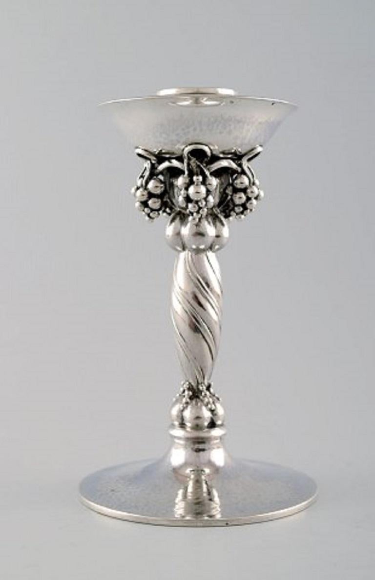 Georg Jensen, pair of candlesticks hammered sterling silver, adorned with twisted vines and grape bunches.
Designed by Georg Jensen 1918, design no. 263 A.
Manufactured after 1945.
Measures: Height 15 cm.
Weight approximate 577 grams.