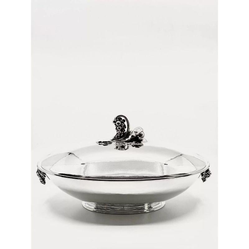A pair of extraordinary monumental vintage Danish sterling silver Georg Jensen oval tureens design #408A by Georg Jensen in 1921. The remarkable feature of these tureens is their large size, which commands attention. Each tureen is crafted with a