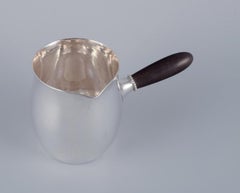 Georg Jensen pitcher in sterling silver with an ebony handle. Model 80A.