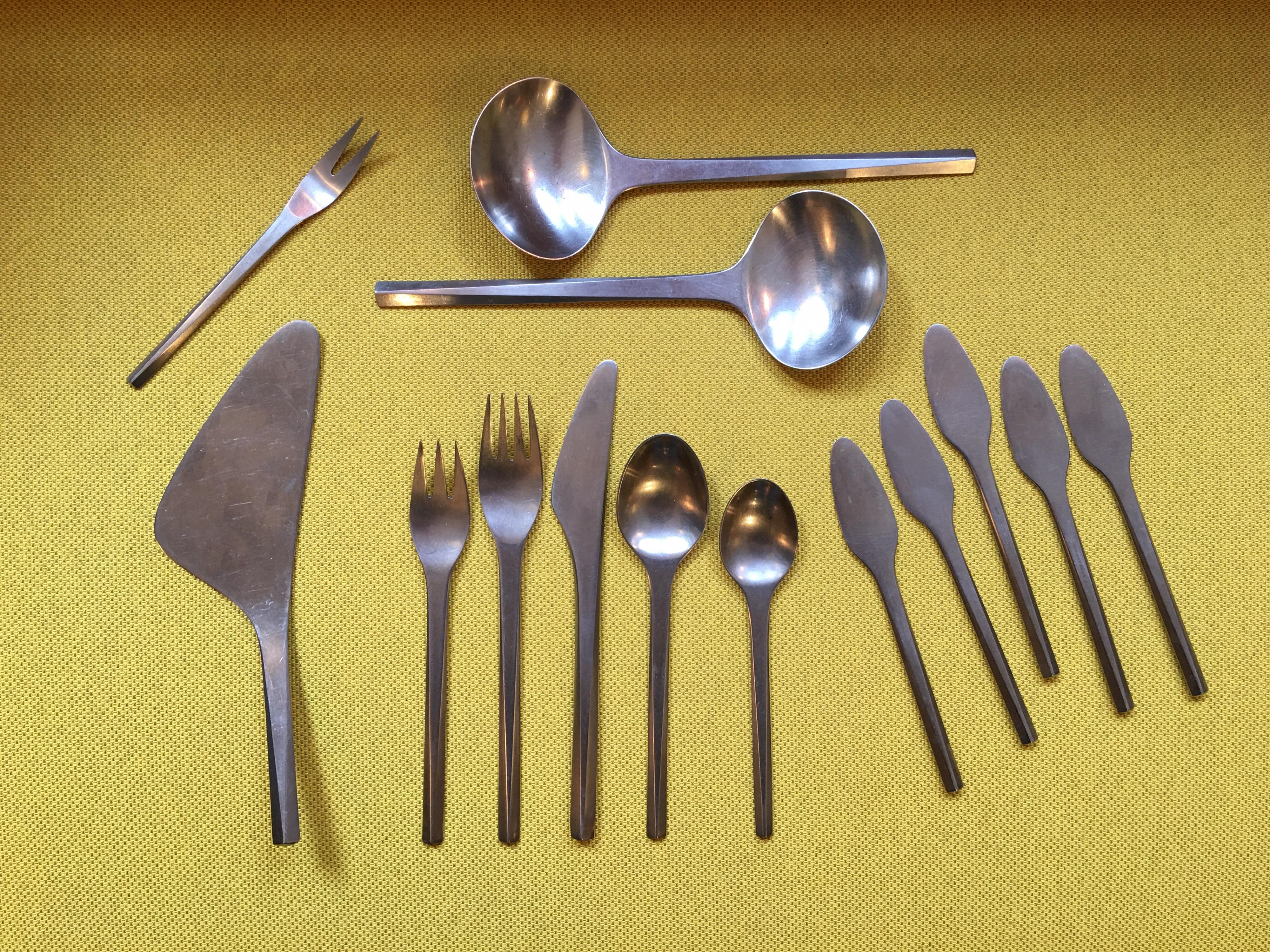 Georg Jensen prism stainless flatware service for 8. Set also includes 2 large serving spoons, pie server, meat fork and 5 butter spreaders. 53 pieces in total. Beautiful triangular design to the handles with a satin finish. All in very good used