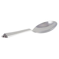 Pirámide Georg Jensen. Abrebotellas de plata de ley y acero inoxidable.