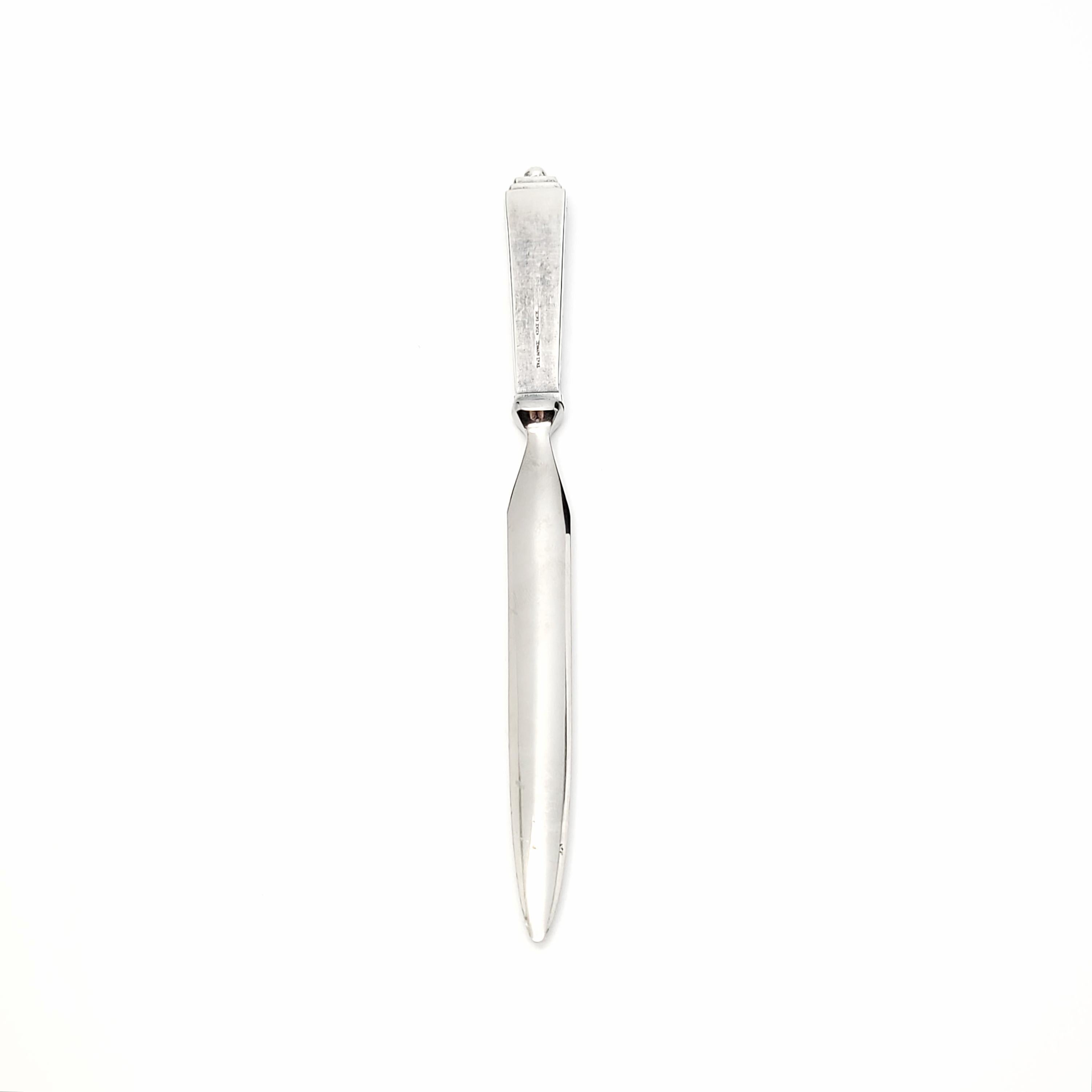 Vintage sterling silver letter opener in the Pyramid pattern by Georg Jensen.

No monogram.

The Pyramid pattern was in production from 1926-1999. The stepped pyramid design topped with a small ball was inspired by Ancient Egyptian