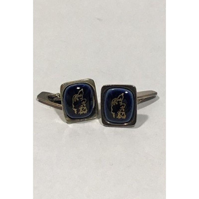 Georg Jensen/Royal Copenhagen Sterling Silver and porcelain Cufflinks (Jutland and Funen) 

Measures 1.5 cm x 1.8 cm(0 19/32 in x 0 45/64 in) Weight 11.5 gr./0.41 oz Weight 11.5 gr/0.40 oz