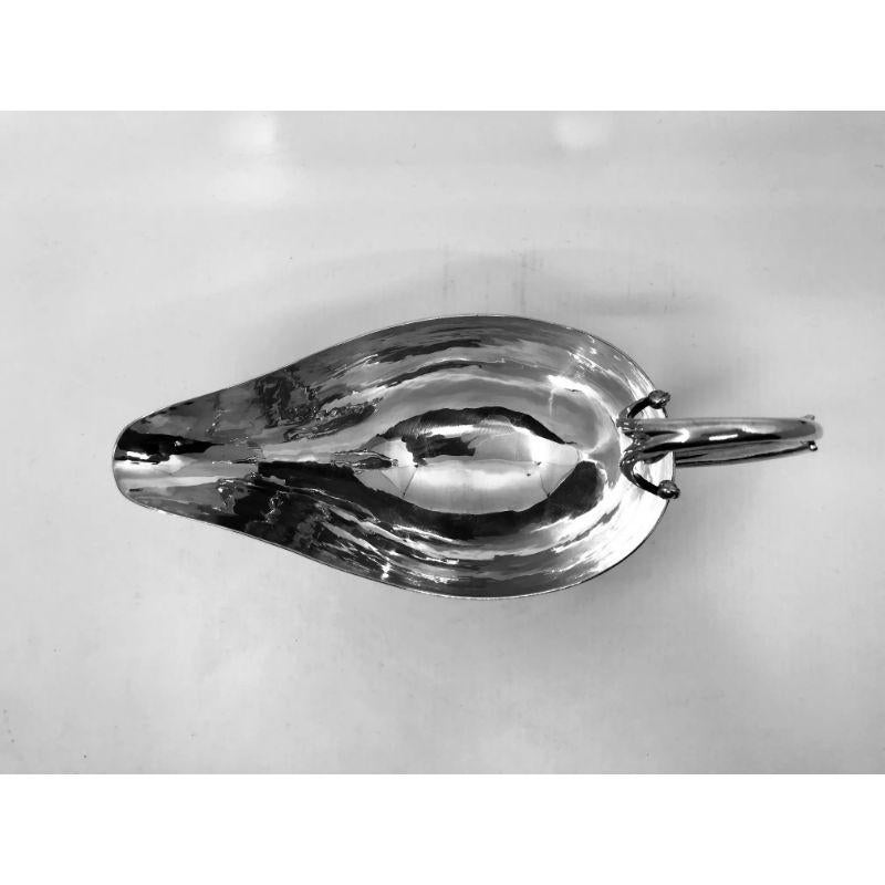 A sterling silver Georg Jensen sauce boat, design #303 by Johan Rohde from circa 1919.

Additional information:
Material: Sterling silver
Styles: Art Nouveau
Hallmarks: We currently have two of these sauce boats; One with vintage Georg Jensen