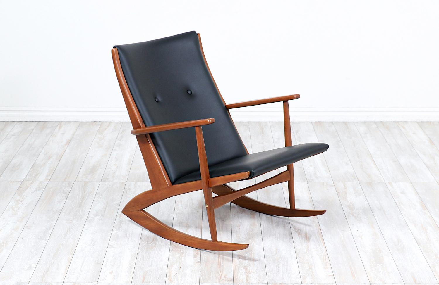 Georg Jensen sculpted teak & leather rocking chair for Kubus Møbler.