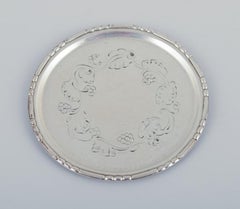 Georg Jensen, set of four glass coasters in sterling silver.
