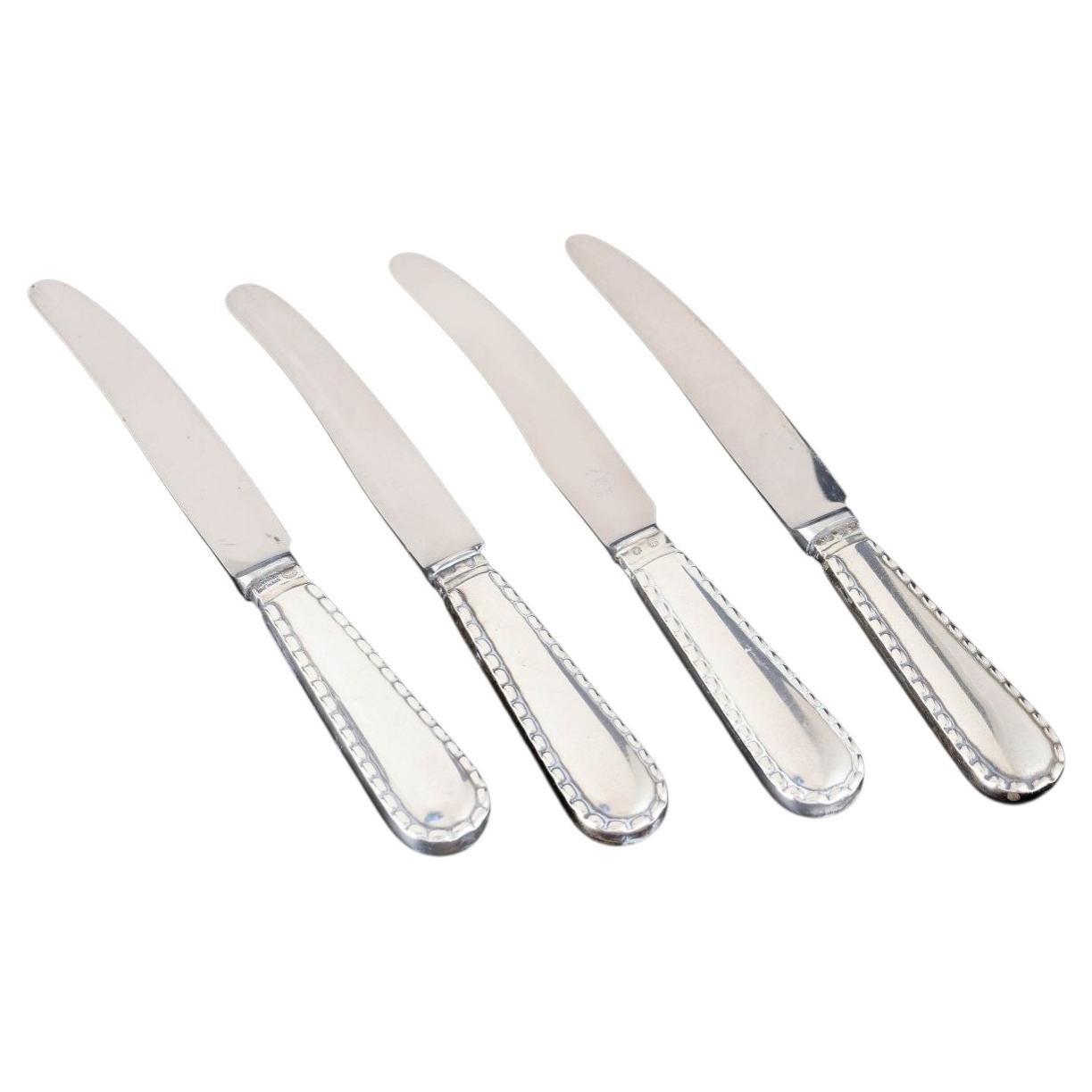 Georg Jensen, set of four knives in silver and stainless steel. Beaded pattern. For Sale