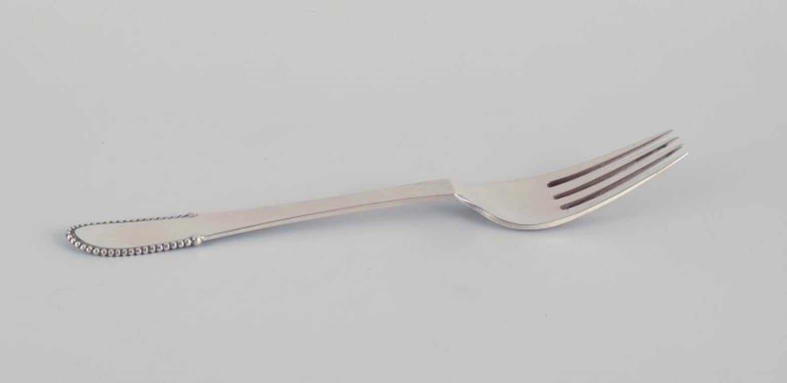 Georg Jensen, a set of six Beaded dinner forks in 830 silver.
Hallmark from 1926-1928.
Perfect condition. As new.
Dimensions: Length 19.4 cm.