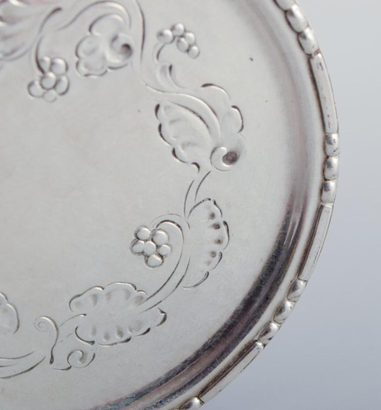 Inizio XX secolo Georg Jensen, set di sei sottobicchieri in vetro in argento sterling. Numero di modello 51A. in vendita