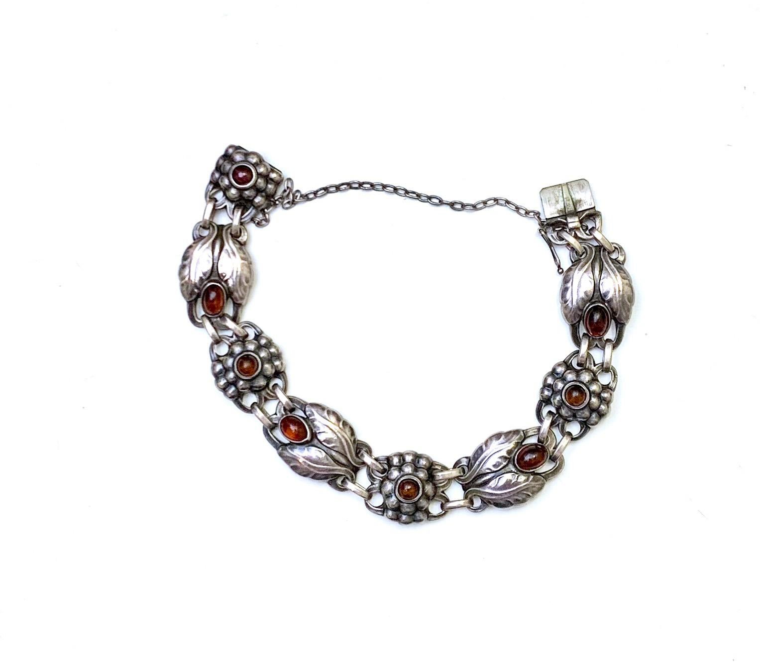 This well crafted Georg Jensen signed silver and amber bracelet is a great piece for any silver jewelry collector.  The bracelet measures 7