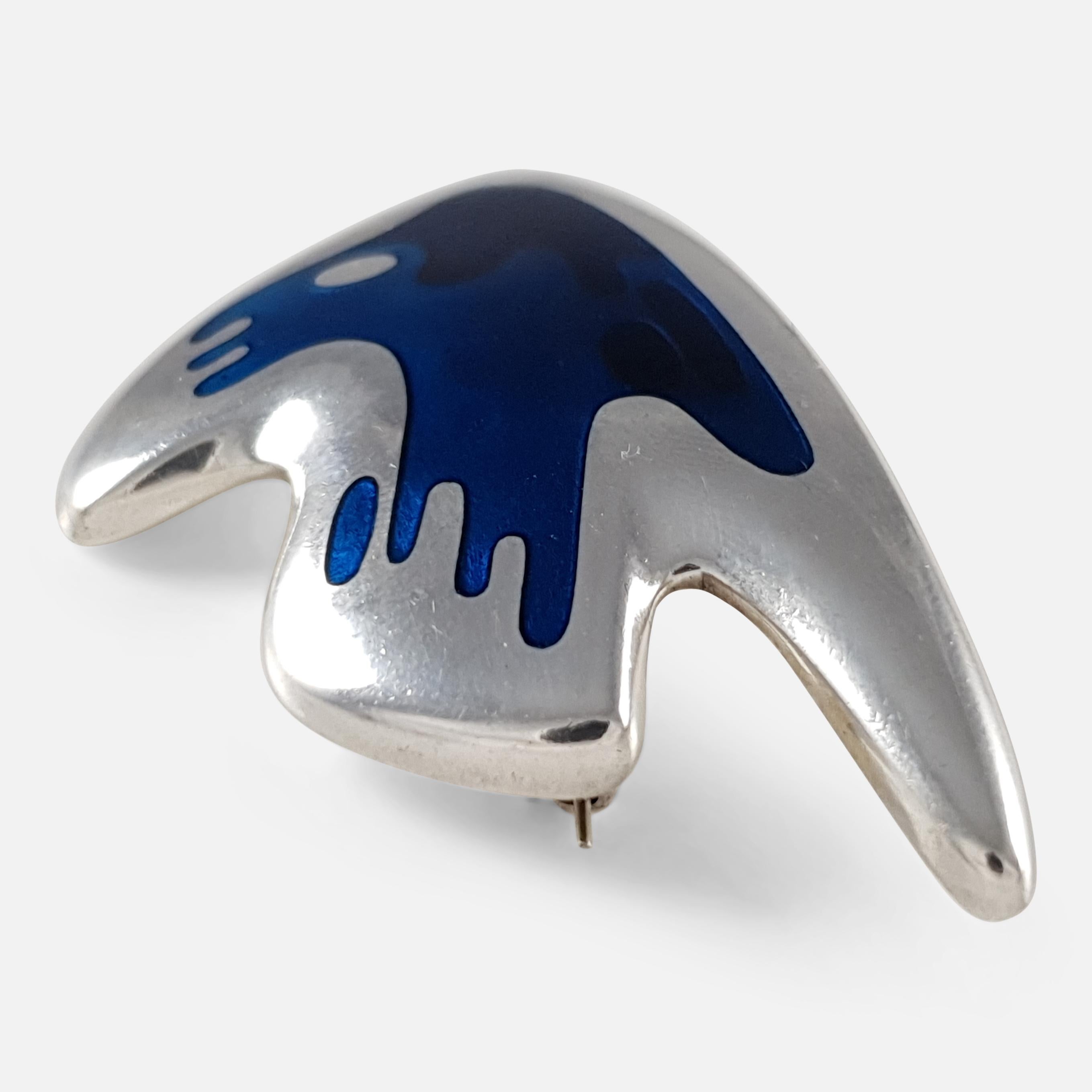 Description: - A superb mid 20th century Georg Jensen sterling silver and blue enamel brooch #307, designed by Henning Koppel. The brooch is stamped Georg Jensen within dotted oval mark, 'STERLING DENMARK', '307', and 'HK'. The brooch is hallmarked