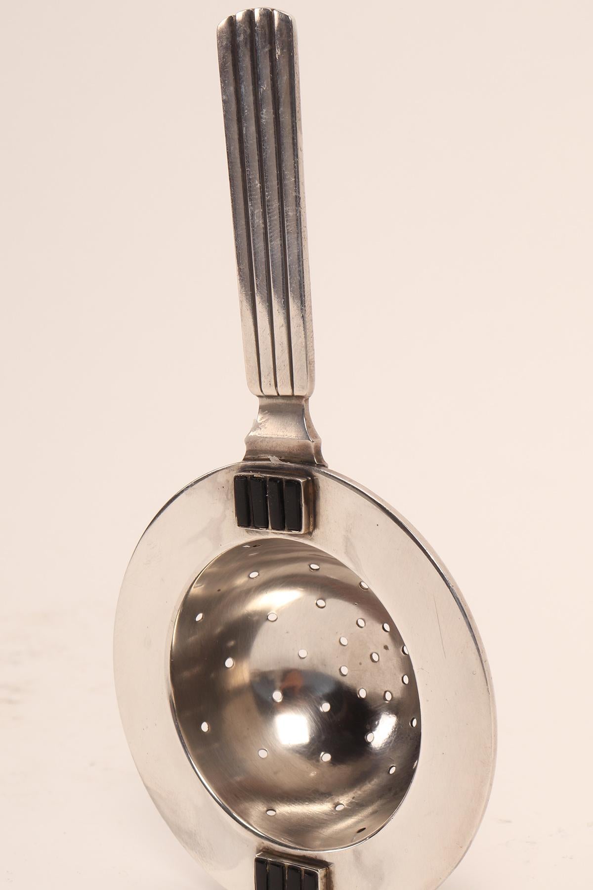 Danish Georg Jensen silver and enamels tea strainer, Denmark 1930. For Sale
