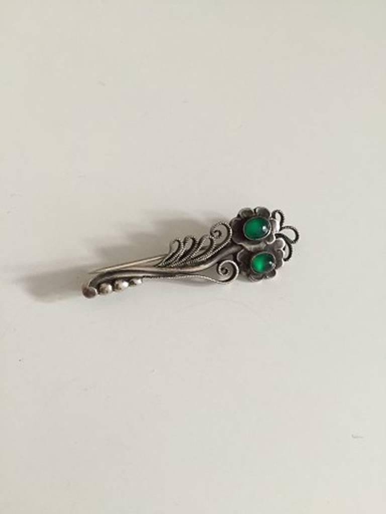 Georg Jensen Silver Brooch with Green Agate #182 from 1910-1920. Measures 5,3cm (2 3/32 in.) and is in good used condition. Weighs 6g / 0,21oz