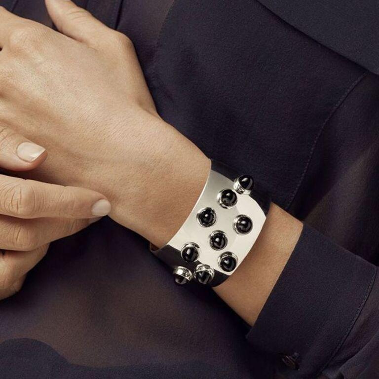 Modern silver cuff bracelet with 9 onyx cabochons designed by Michelsen for Georg Jensen. This rare piece is a reissue of a vintage model. 

2017 collection, discontinued item, no longer available in stores. 

Size S/M - not suitable for large