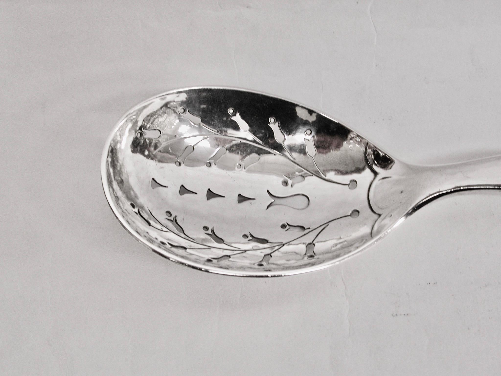 Georg Jensen Silver Hand Pierced Fruit Spoon Dated circa 1915, Pattern no 38
Made in Copenhagen,Denmark
This serving piece has a lovely weight, is 3.44 troy ounces and is hand wrought
with hand hammering and piercing.
It has built up a lovely